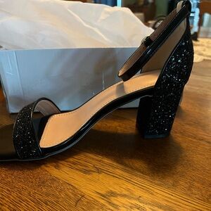 Open toe high heel, black. New in box.